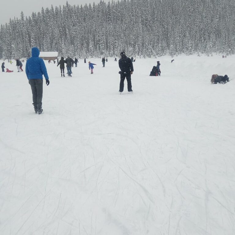 Ice skaters on frozen Lake Louise