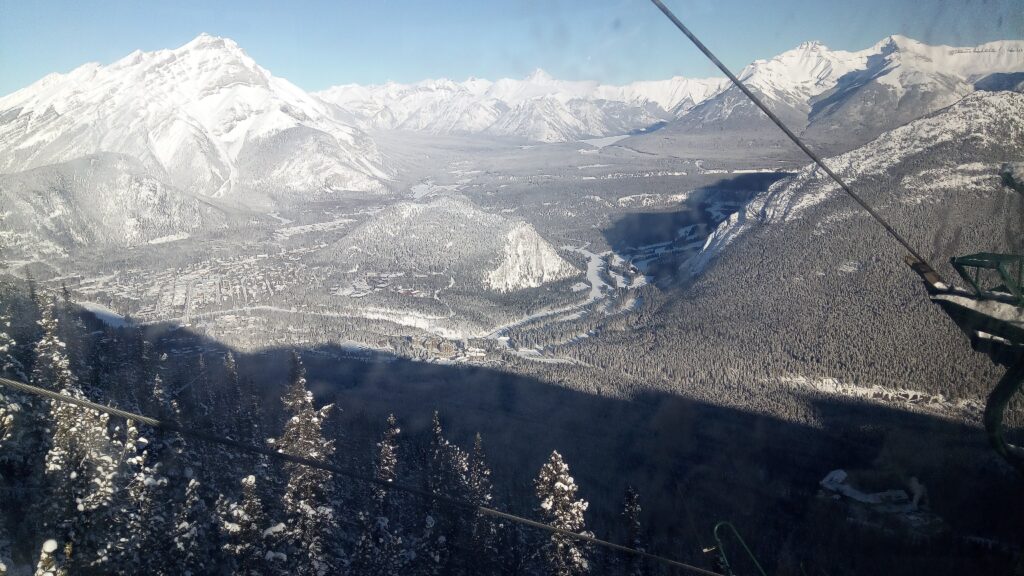 View overlooking the Bow Valley from inside a Banff Gondola cable car. 