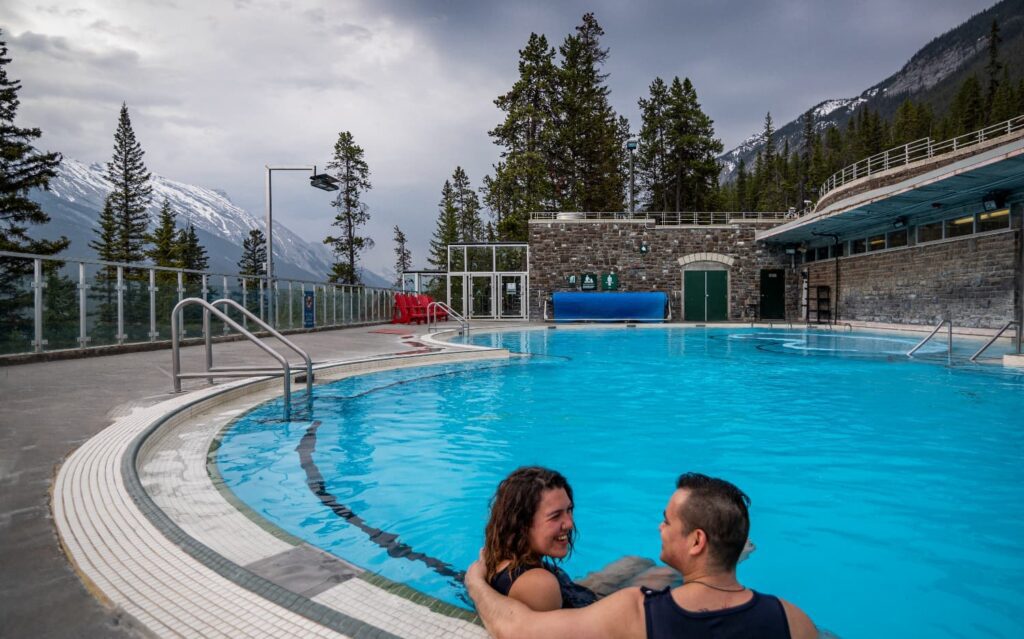 Couple relaxing in Banff upper hot springs in winter