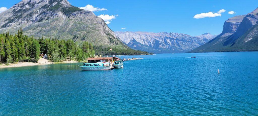 Lake Minnewanka in summer with boats on the lake