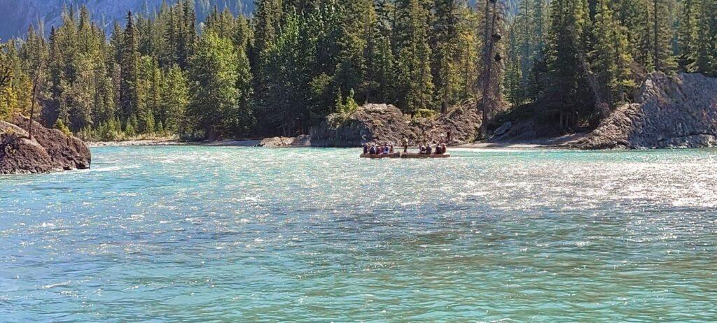 Rafting tour floating down Bow River in Banff on a summer's day