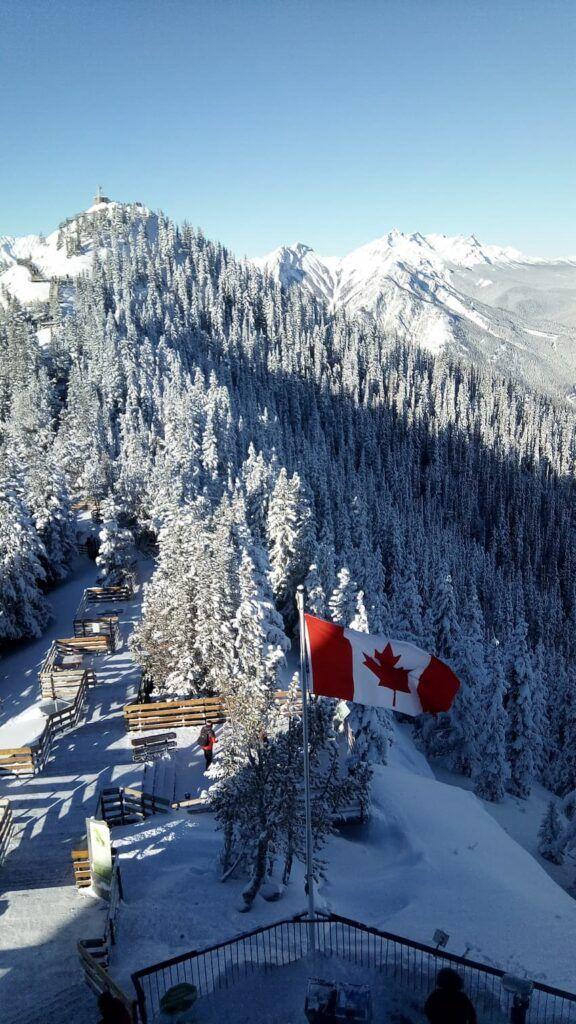 View from top of Banff Gondola at Christmas with snow covered trees and mountains