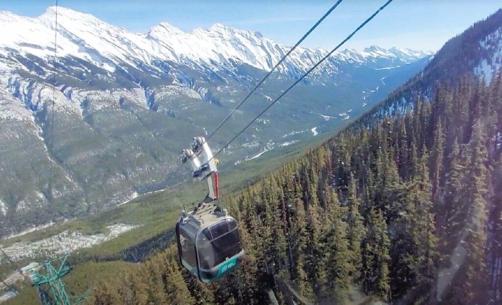 View of Rocky Mountains from inside Banff gondola